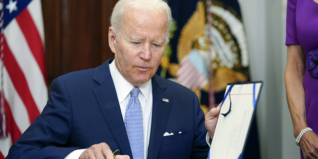 "This law and the love defense strike a blow against hate in all its forms," Biden said Tuesday of the Respect for Marriage Act. 