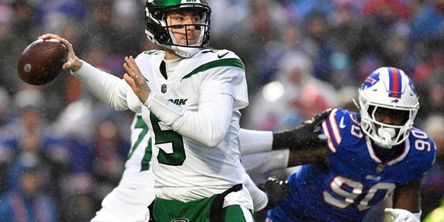 New York Jets quarterback Mike White winds up to pass against the Buffalo Bills, Sunday, Dec. 11, 2022, in Orchard Park, New York.