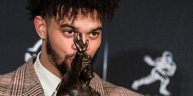 Southern California quarterback Caleb Williams poses for a photograph after winning the Heisman Trophy, Saturday, Dec. 10, 2022, in New York.