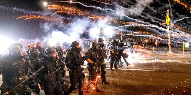 Police use chemical irritants and crowd control munitions to disperse protesters during a demonstration in Portland, Oregon, on Sept. 5, 2020.