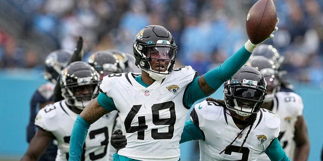 Jacksonville Jaguars defensive end Arden Key (49) celebrates after recovering a fumble during the second half against the Tennessee Titans, Sunday, Dec. 11, 2022, in Nashville, Tennessee.