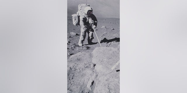 Lunar module pilot Harrison H. Schmitt collects geological samples on the moon during his EVA (extra-vehicular activity) on NASA's Apollo 17 lunar landing mission in 1972.