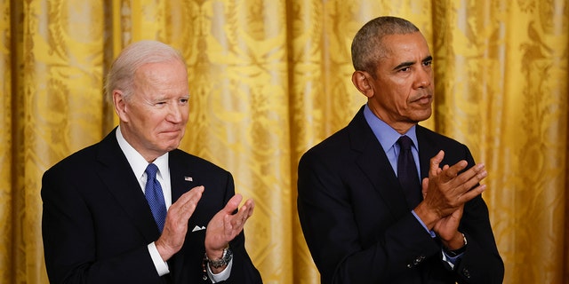 President Biden and former President Obama attend an event to mark the 2010 passage of the Affordable Care Act in the East Room of the White House April 5, 2022, in Washington, D.C.