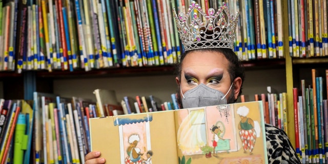 Drag queen "Just JP" reads stories to children during a "drag story hour" at Chelsea Public Library in Chelsea, Massachusetts, on June 25, 2022.