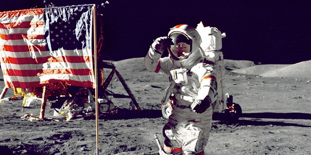 Eugene A. Cernan, commander, Apollo 17, salutes the U.S. flag on the lunar surface during extra-vehicular activity (EVA) on NASA's final lunar landing mission.