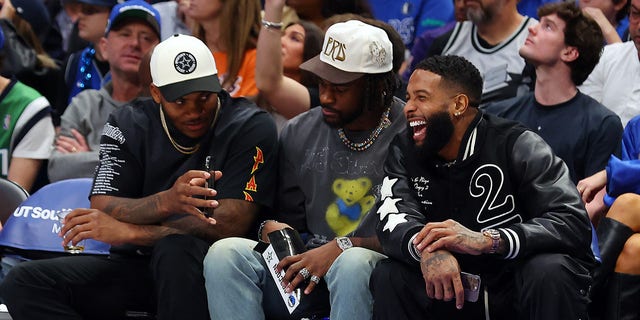 Dallas Cowboys Micah Parsons and Trevon Diggs attend the NBA game between the Phoenix Suns and Dallas Mavericks with Odell Beckham Jr. at American Airlines Center on December 05, 2022 in Dallas, Texas. 