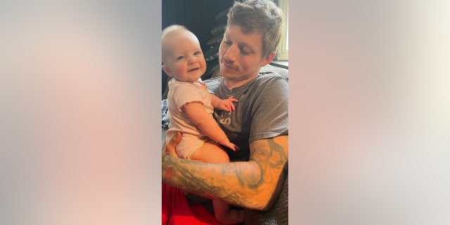 Pictured here are Kennedy and her father, David. Kennedy is a "very resilient and strong baby, and sweet and silly despite what she's gone through," said her mother.