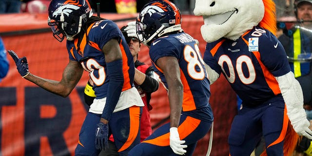 Denver Broncos wide receiver Jerry Jeudy, left, celebrates a touchdown catch during the second half of a game against the Kansas City Chiefs Sunday, Dec. 11, 2022, in Denver. 