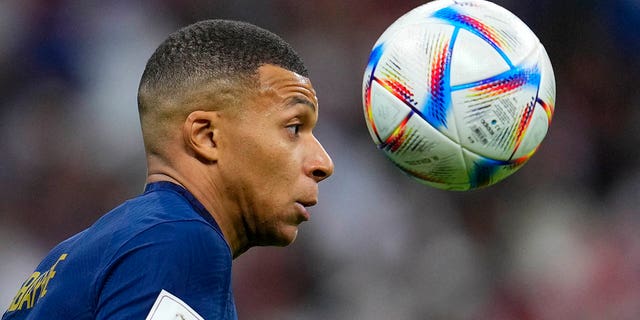 France's Kylian Mbappe attempts to control the ball during the World Cup quarterfinal soccer match between England and France, at the Al Bayt Stadium in Al Khor, Qatar, Saturday, Dec. 10, 2022.