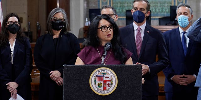 Then-Los Angeles City Council President Nury Martinez, at podium, and Mayor Eric Garcetti, standing to her right, are seen during a news conference at Los Angeles City Hall in Los Angeles on April 1, 2022.