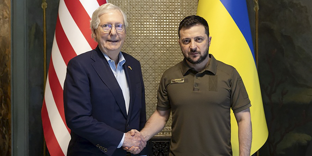 Ukrainian President Volodymyr Zelenskyy and Senate Minority Leader Mitch McConnell, R-Ky., pose for a photo in Kyiv, Ukraine, May 14, 2022.