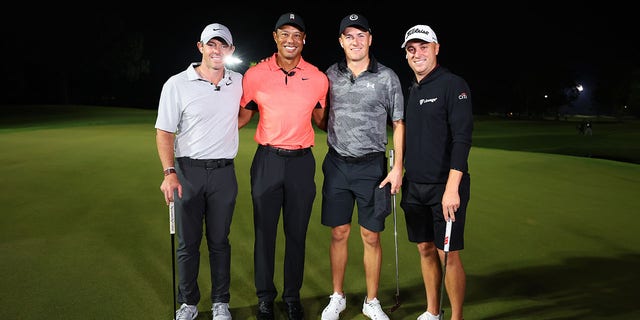 (L-R) Rory McIlroy of Northern Ireland and Tiger Woods of the United States pose with Jordan Spieth of the United States and Justin Thomas of the United States after Spieth and Thomas defeated McIlroy and Woods during The Match 7 at Pelican at Pelican Golf Club on December 10, 2022 in Belleair, Florida.