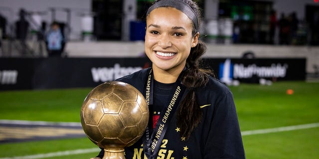 Sophia Smith #9 of the Portland Thorns FC holds the Player of the Match after winning the National Women's Soccer League Championship Match against Kansas City Current at Audi Field on October 29, 2022 in Washington, DC. 