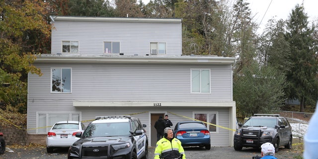 Police search a home in Moscow, Idaho on Monday, November 14, 2022 where four University of Idaho students were killed over the weekend in an apparent quadruple homicide. 